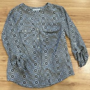 Notations black and tan blouse.